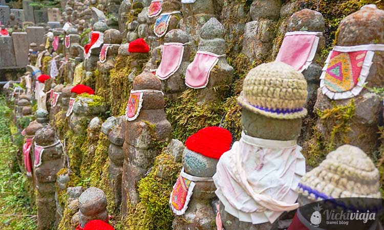 Stone statues, Buddism, statues with clothes on, mossy, Japan